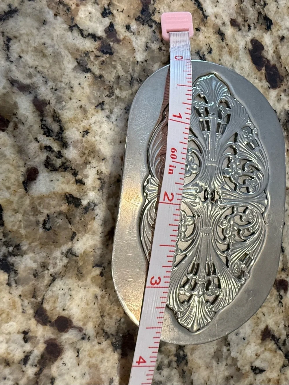 Western silver tone ornate floral scrolled belt buckle
